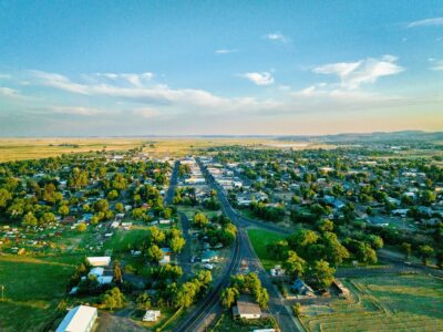 A top down view of a Harney Basin community dotted with trees with views into the skyline